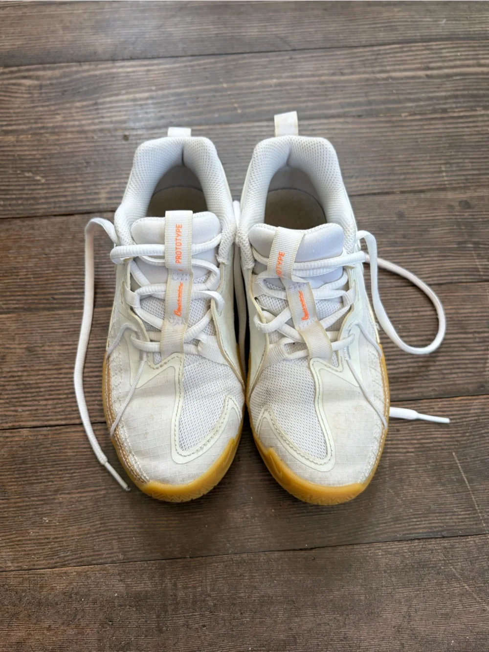 Nike White Basketball Sneakers with Orange Accents and Gum Sole